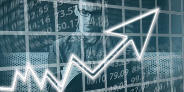 The Federal Reserve signaling potential interest rate cuts has spurred significant gains for stocks such as Coherent and Liberty Broadband.